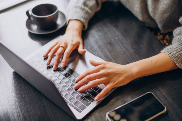 female-hands-typing-computer-keyboard