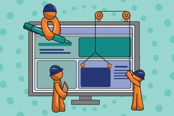 three orange guys in construction hats building a website on a computer